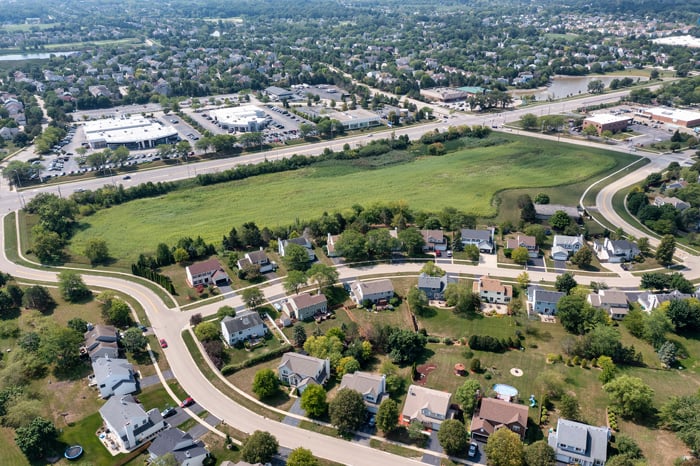 Aerial view of residential properties and road network representing title mapping and cadastral land records