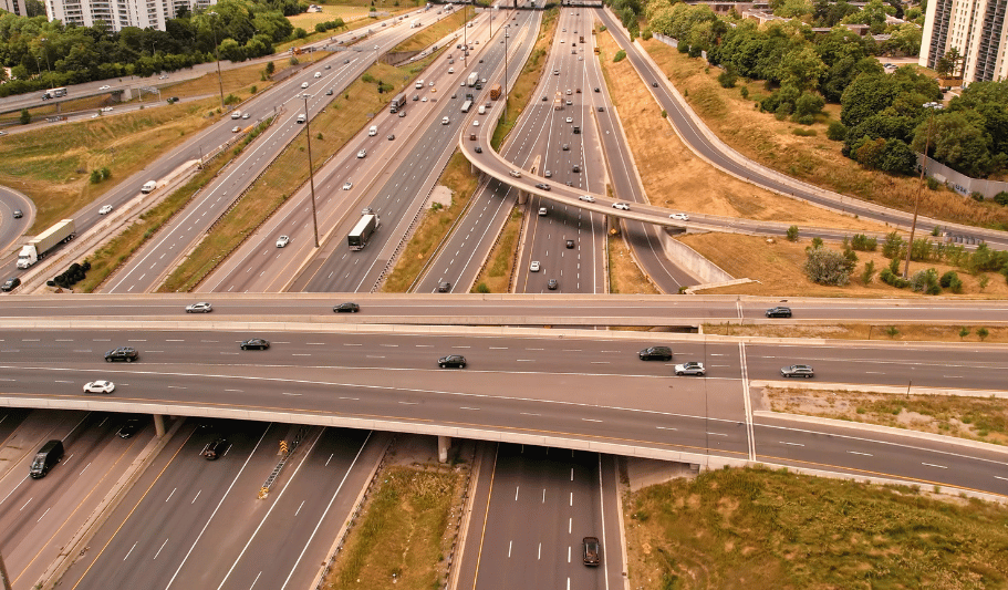 Multi-lane highway interchange representing transportation infrastructure and regional planning initiatives